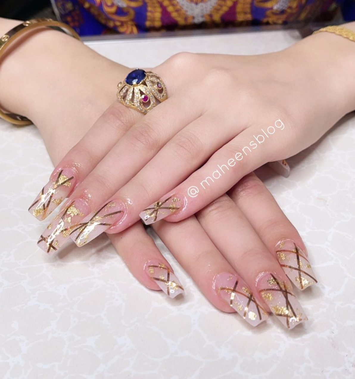 Transparent nails with Gold flakes and Stripes